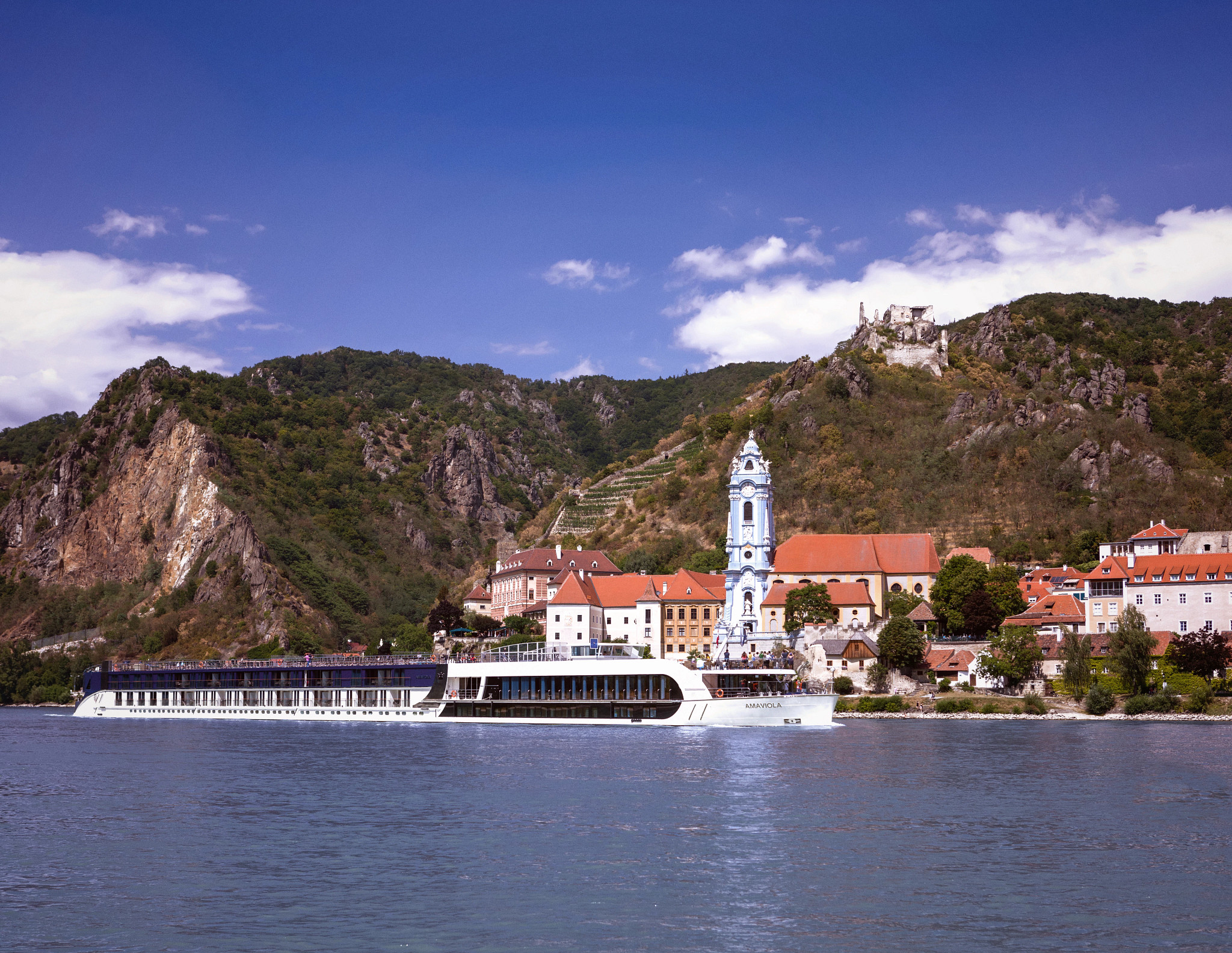 AmaViola river cruise ship docked at the historic village of Dürnstein along the Danube