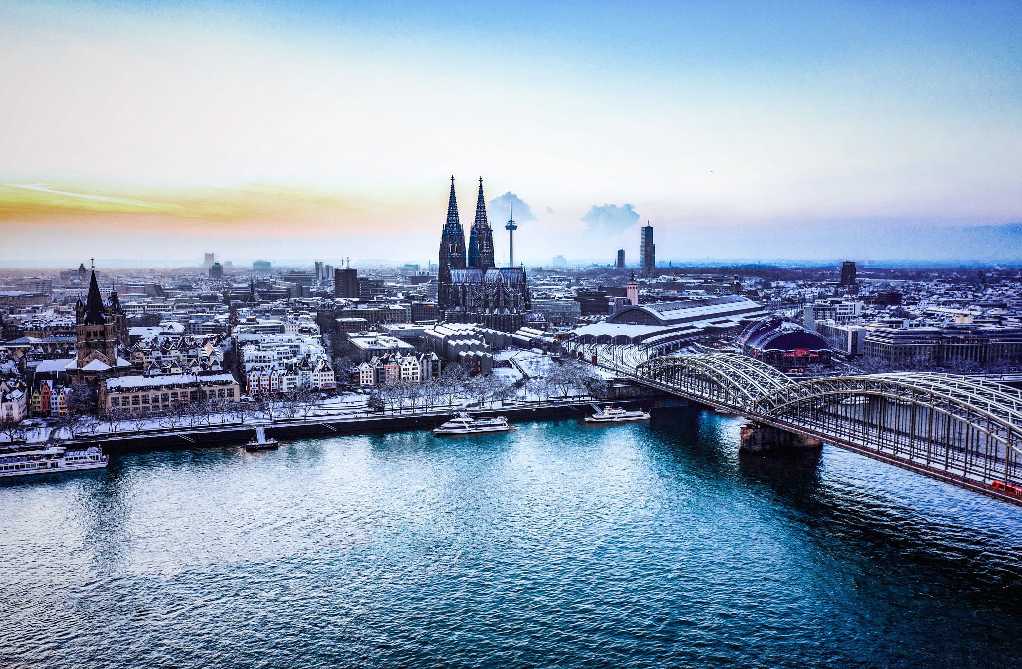 Cologne Cathedral and Rhine River vineyards under golden afternoon light